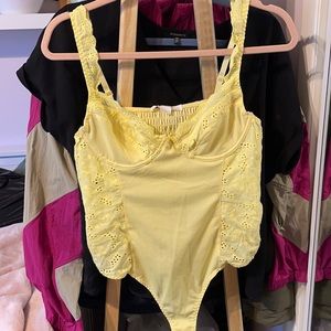Yellow frilly bodysuit